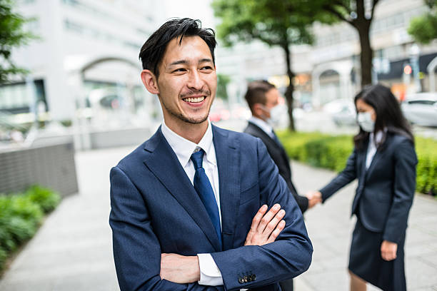 istock Business japanese team standing togetherness 547170844