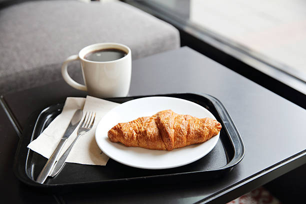 istock croissant and coffee in coffee shop 547198870