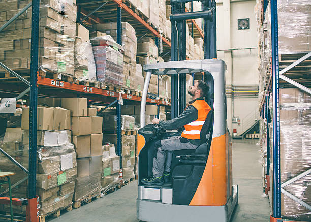 istock Fork lift truck driver and palets 547199892
