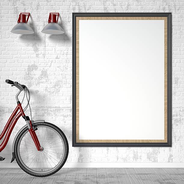 Blank picture frame with bike and wall light. Mock up