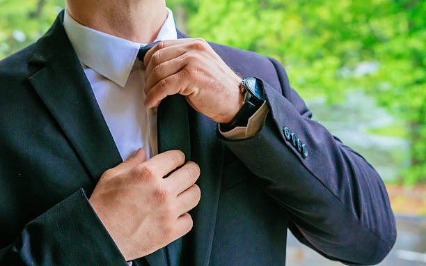 istock Hands of wedding groom getting ready in suit 547200920