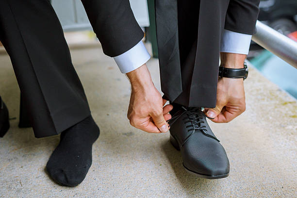 istock Hands of wedding groom getting ready suit 547200938