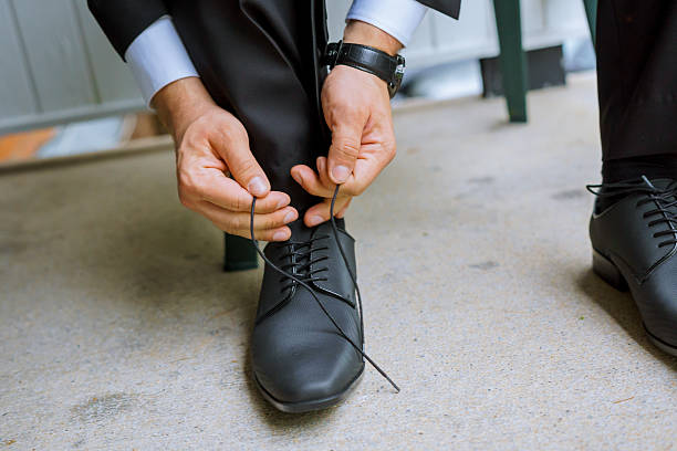 istock Hands of wedding groom getting ready suit 547200960