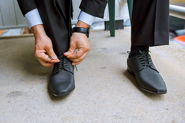 istock Hands of wedding groom getting ready suit 547200974