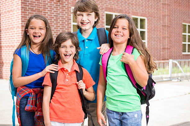 istock Back to School:  Elementary-age children, friends on school campus. 547201448