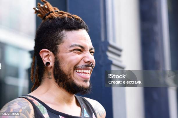 Young Man Laughing Stock Photo - Download Image Now - Tattoo, Candid, African-American Ethnicity