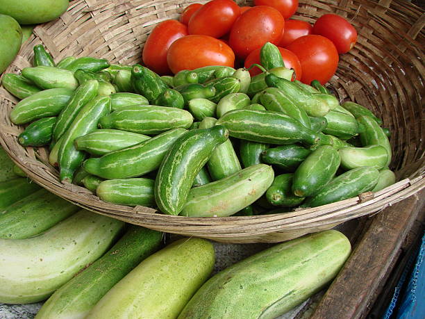 istock cucumbers and tomatoes in a basket 547204472