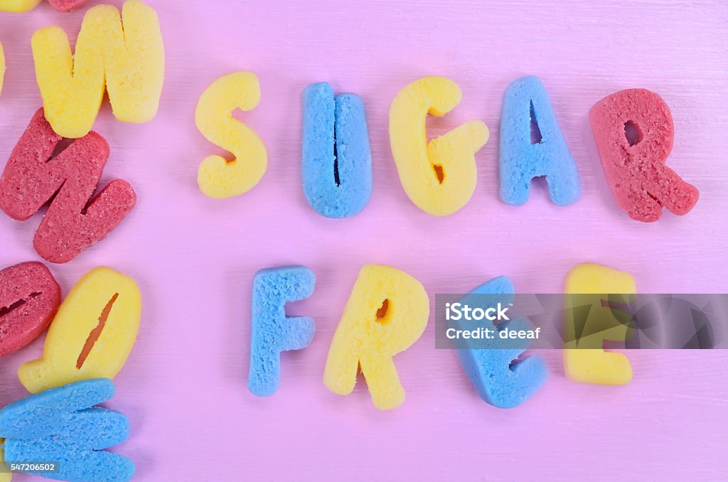 Words Sugar Free on pink table Words Sugar Free on pink wooden table Above Stock Photo