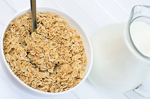 istock White bowl with oat flakes and milk on table 547206776