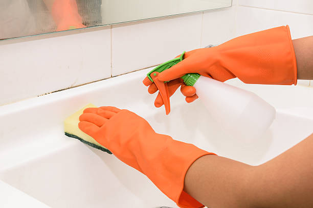 istock woman doing chores in bathroom at home 547207466