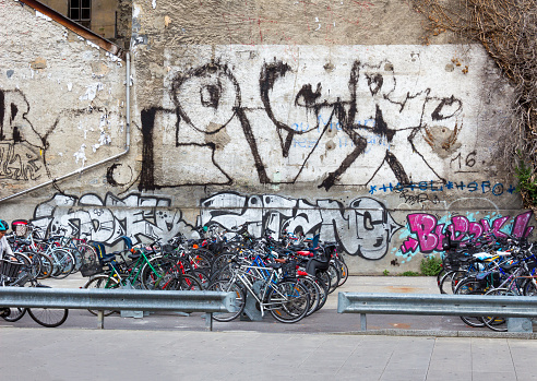 Geneva, Switzerland - June 17, 2016: The graffiti and bicycles on street in Geneva