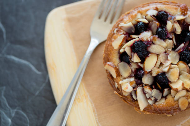 Marionberry Almond Frangipane Tart Marionberry (blackberry) almond frangipane tart on bamboo and slate background. marionberry stock pictures, royalty-free photos & images