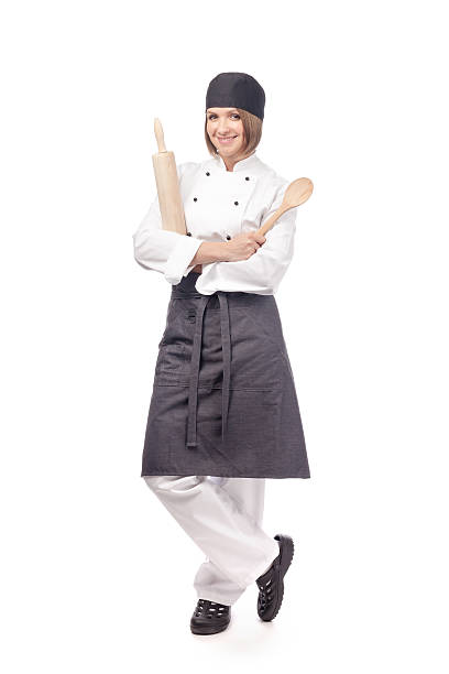 chef, cook or baker isolated on white cheerful female chef, cook or baker with wooden spoon and rolling pin isolated on white background. restaurant, dieting and cooking food concept indoors restaurant hotel work tool stock pictures, royalty-free photos & images