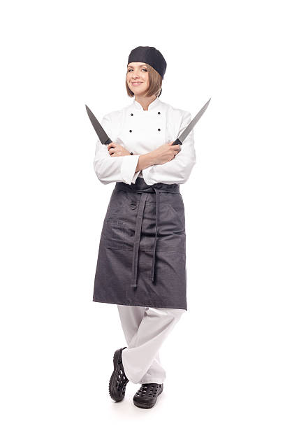 istock chef or cook with knifes isolated on white 547216766