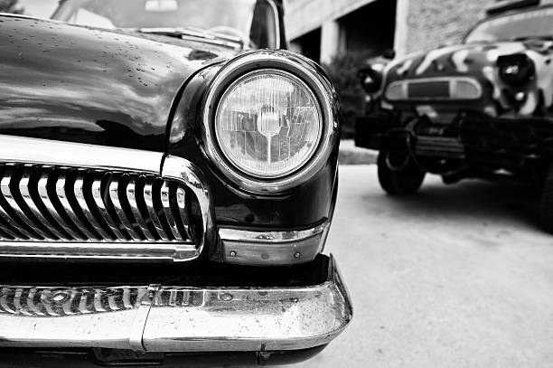 istock Old vintage car headlight close up. Black and white photo 547219012