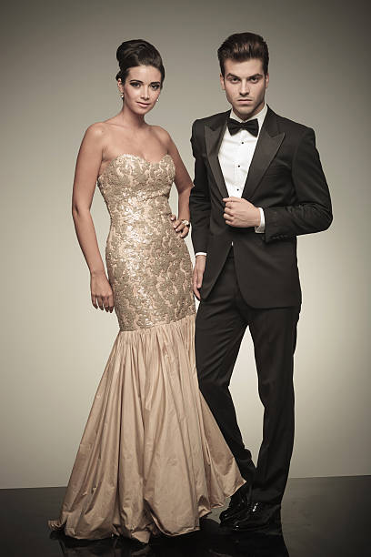 istock Young elegant man and woman posing 547220918