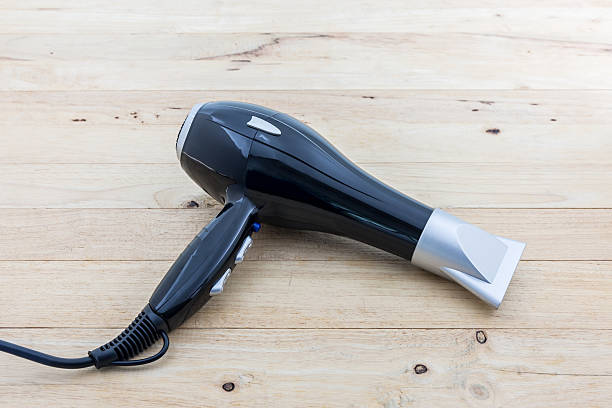 istock Black hair dryer. 547221238