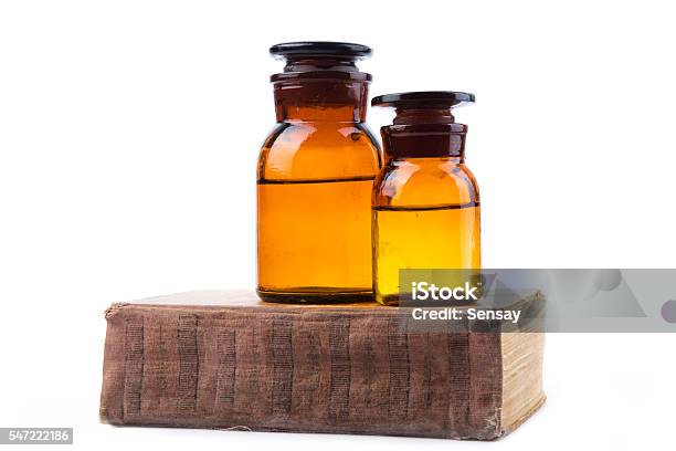 Vintage Medicine Pharmacy Bottles With Book Stock Photo - Download Image Now - Antique, Book, Bottle