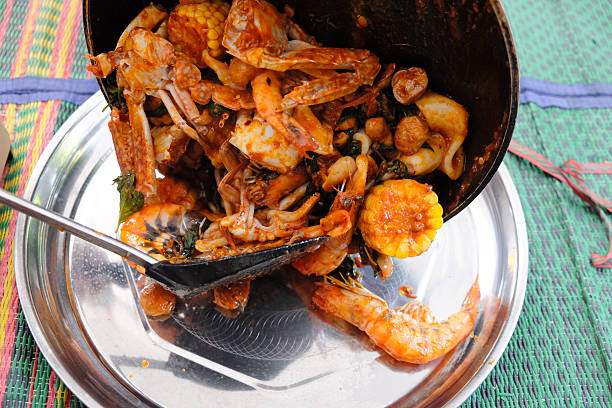 istock Fried shrimp ,squid and crab with basil with hot and spicy sour 547222238