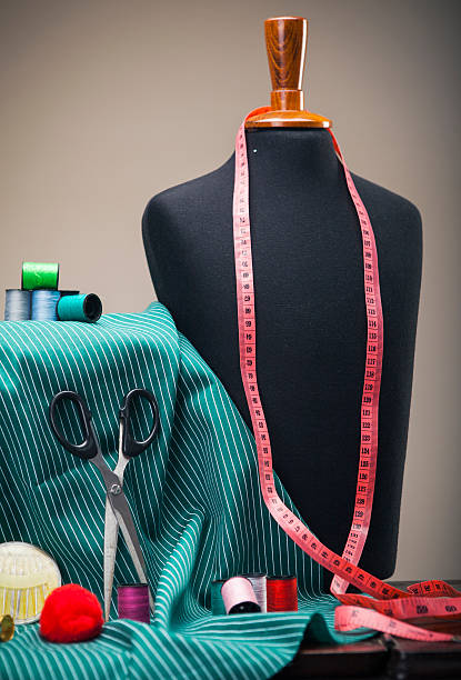 istock Old tailor workshop with sewing fashion dummy and cloth. 547224538