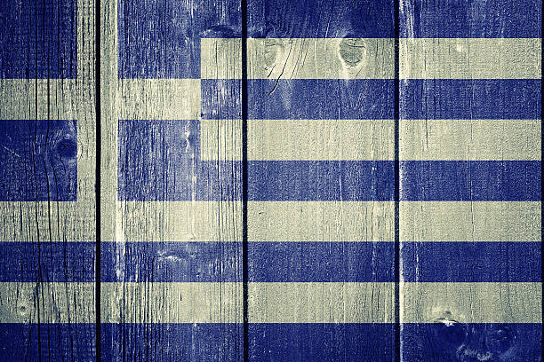 istock Greek flag on wood background 547226048