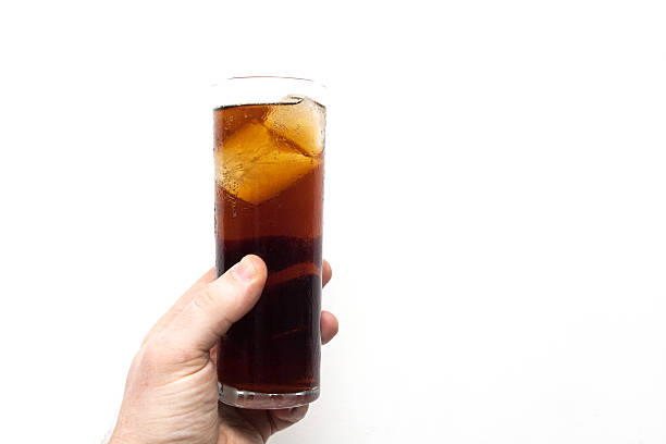 istock man holding glass of alcoholic drink 547227130