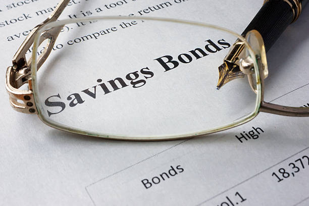 istock Page of newspaper with words savings bonds. 547229446