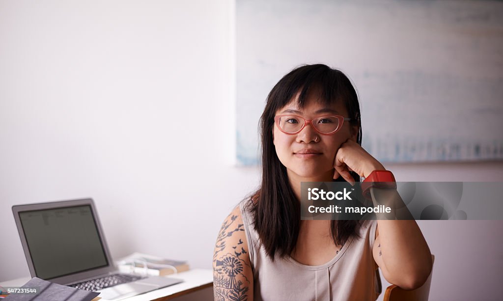 I'm not a nerd, I'm just smarter than you Portrait of a pretty young woman sitting with her laptop at her desk Women Stock Photo