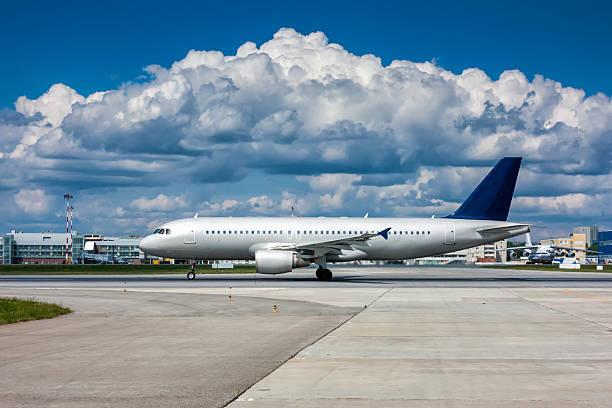 istock Plane on the runway with a beautiful textured sky 547232220
