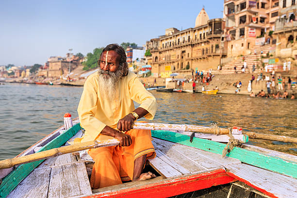 istock Sadhu rowing boat on the holy Ganges River in Varanasi 547232984