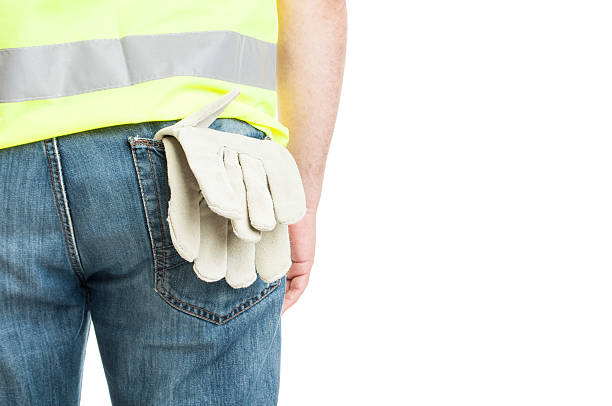 istock Builder with gloves in pocket wearing safety vest 547233024