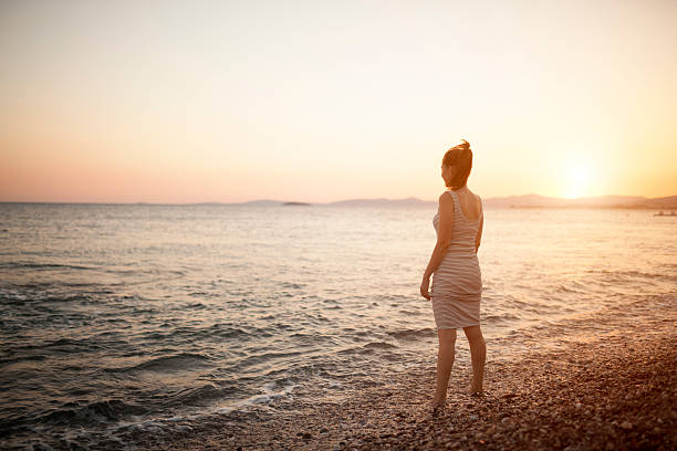 istock Young woman relaxation at beach 547234980