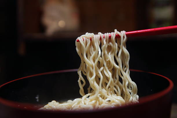 istock instant noodles , Japanese noodle in black background 547235292