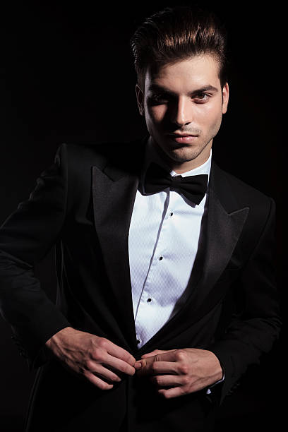 istock Handsome business man closing his jacket. 547235376