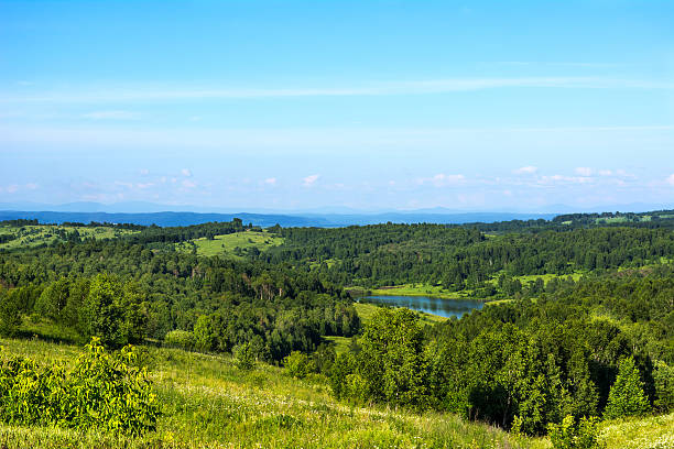 istock Summer beautiful hills landscape with blue lake 547235412