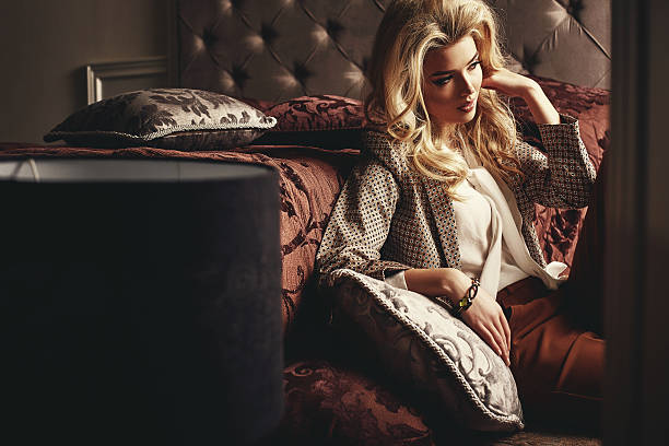 istock Beautiful woman in modern bedroom 547235452