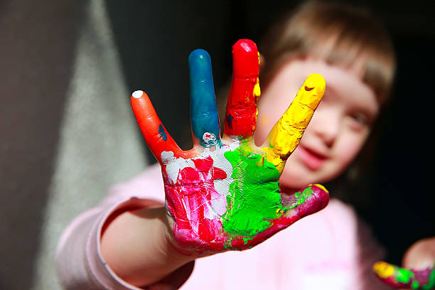 istock Cute little girl with painted hands 547236250