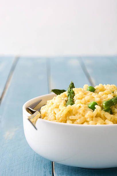 istock Risotto with asparagus, parsley and peas 547236356