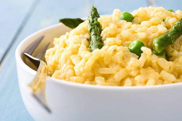 istock Risotto with asparagus, parsley and peas 547236452