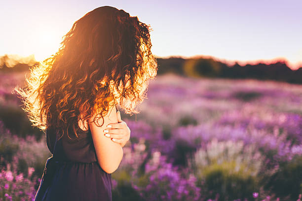 istock young woman at lavander field 547241622