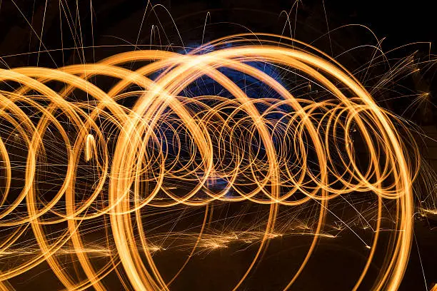 Burning Circles Inside Tunnel. Long Expose Technique Was Used For This Image.Useful For Graphic Design or Event Background.