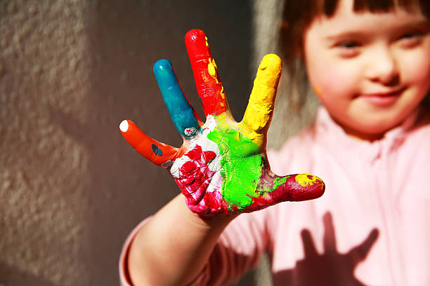 istock Cute little girl with painted hand 547242032