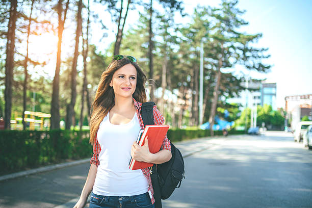 istock Happy young student outdoors 547242162