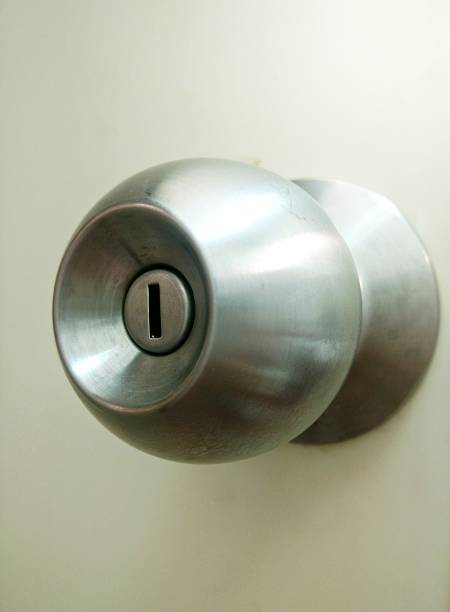 istock metallic doorknob on a wooden door 547242678
