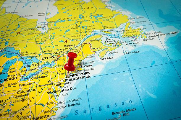 istock Red thumbtack in a map, pushpin pointing at New York 547246122