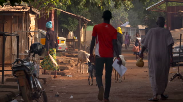 people walking down the street in ghana