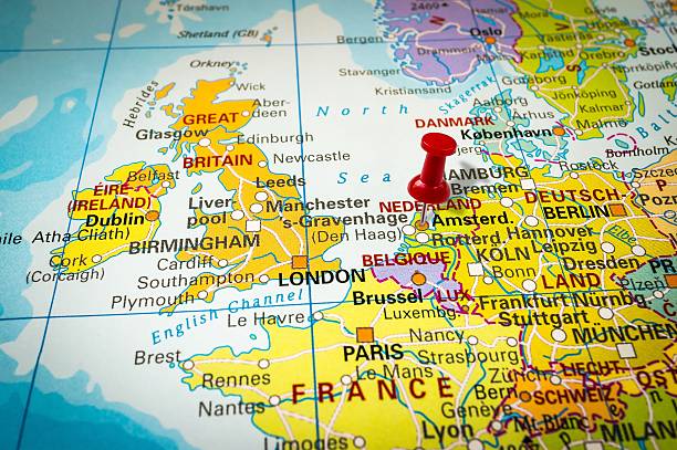 istock Red thumbtack in a map, pushpin pointing at Amsterdam 547404034