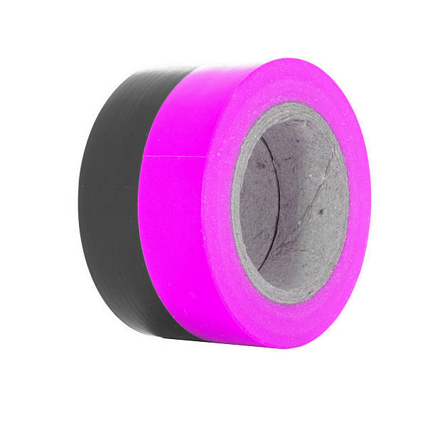 istock Protective black, pink insulating tape rolls isolated on white background 547404100