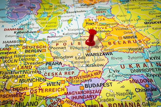 istock Red thumbtack in a map, pushpin pointing at Warsaw 547404348