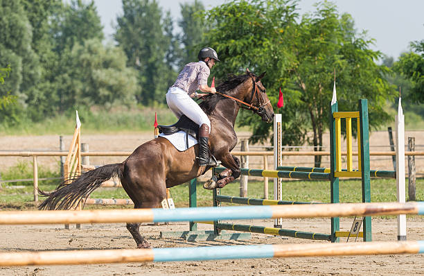 istock Young man riding a horse 547404360